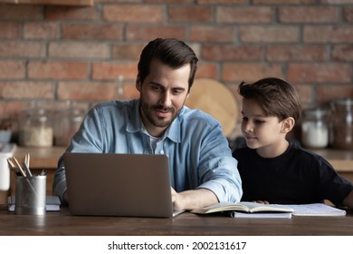 Best Dad Helping Schoolboy Son, Explaining School Homework To Child. Father And Kid Using Laptop At Table Together, Watching Learning Webinar, Online Virtual Lesson. Family Support, Homeschool Concept