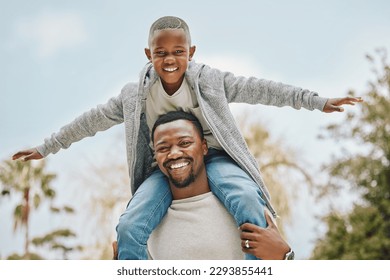 Best dad in the world. Cropped portrait of an adorable little boy sitting on his fathers shoulders outside. - Powered by Shutterstock