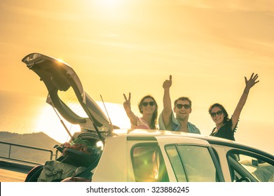 Best Friends Having Fun And Cheering By Car Road Trip At Sunset - Group Of Happy People Outdoor On Vacation Tour - Friendship And Youth Concept At Travel Together With Positive Nostalgic Emotions