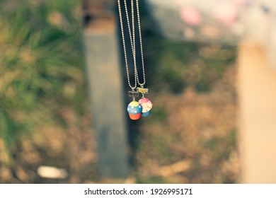 Best Friends Necklace Shoot Outside In A Summer Day Closeup. Selective Focus