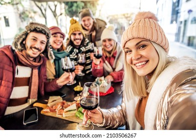 Best Friends Taking Selfie Sitting In Restaurant For Dinner  - Group Of Young People At Terrace Party Drinking Red Wine Together - Friendship And Happy Lifestyle Concept