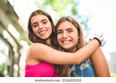 The best friends teen girl embracing each other with smiling - Powered by Shutterstock