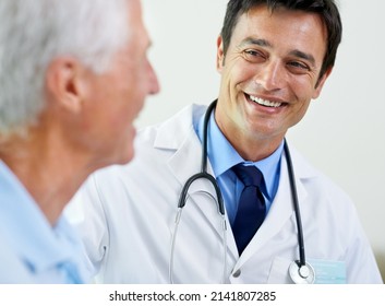 Its The Best Outcome. Shot Of A Handsome Young Doctor Delivering News To A Senior Patient.