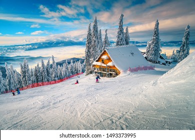 The Best Popular Winter Ski Resort With Skiers In Romania. Amazing Touristic And Winter Holiday Destination. Winter Sunny Day In Poiana Brasov Ski Resort, Transylvania, Romania, Europe