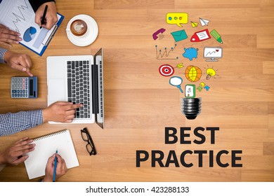 BEST PRACTICE     Business team hands at work with financial reports and a laptop - Shutterstock ID 423288133