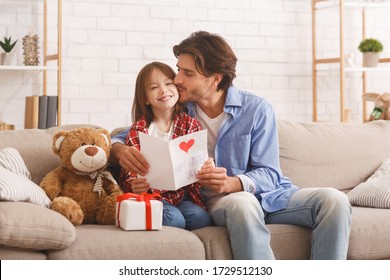 The Best Present Is You. Happy Daddy Kissing His Smiling Little Daughter On Father Day, Home Interior, Copy Space