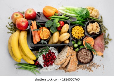 Best sources of carbs on light gray background. Healthy food concept. Top view, copy space