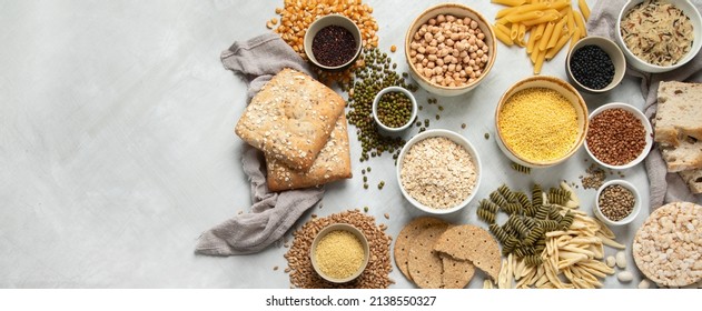Best sources of carbs on light gray background. Healthy food concept. Top view, flat lay, copy space, panorama