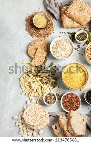 Best sources of carbs on light gray background. Healthy food concept. Top view, flat lay, copy space