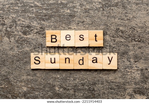 best sunday word written on\
wood block. best sunday text on cement table for your desing,\
concept.