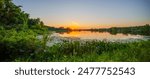 Best sunset stock photo. Panorama of asunset over a lake swamp scene Florida