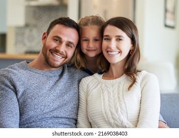 The Best Support System. Shot Of A Young Family Relaxing On The Couch At Home.