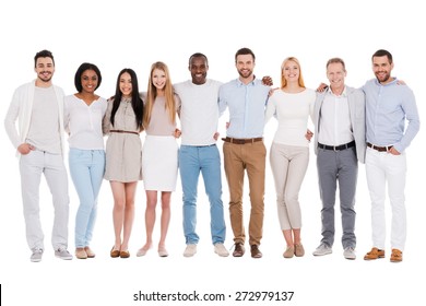 The Best Team Ever. Full Length Of Happy Diverse Group Of People Bonding To Each Other And Smiling While Standing Against White Background Together