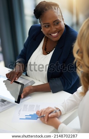 Its the best tool to drive efficiency into business. Shot of two businesspeople working together in an office.