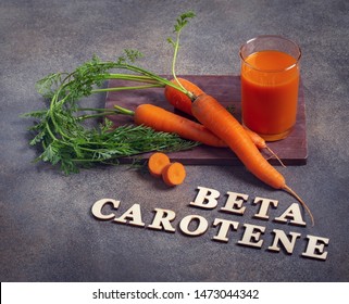 Beta Carotene Text And Carrot Juice Glass