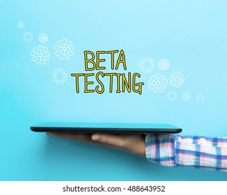 Beta Testing concept with a tablet on blue background