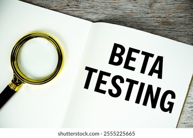 Beta Testing text written on chalkboard with alarm clock on wooden background