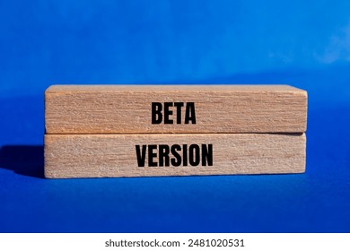 Beta version message written on wooden blocks with blue background. Conceptual beta version symbol. Copy space.