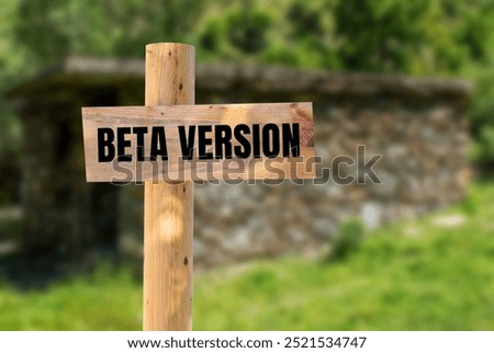 Beta version message written on wooden sign with nature background. Conceptual beta version symbol. Copy space.