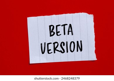 Beta version words written on ripped paper with red background. Conceptual beta version symbol. Copy space.