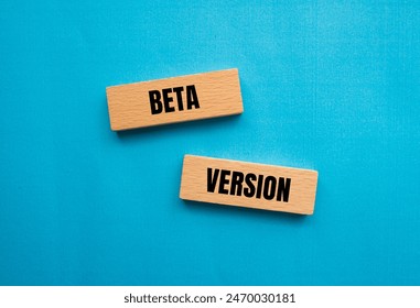 Beta version words written on wooden blocks with blue background. Conceptual beta version symbol. Copy space.