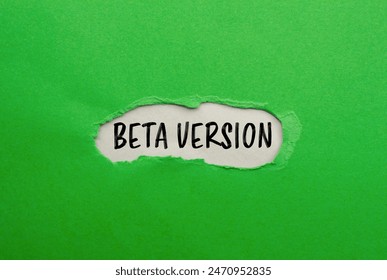 Beta version words written on ripped green paper with gray background. Conceptual beta version symbol. Copy space.