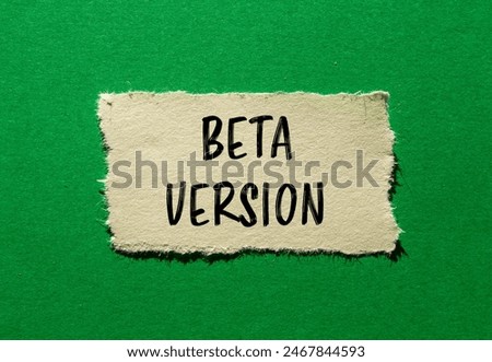 Beta version words written on ripped paper with green background. Conceptual beta version symbol. Copy space.