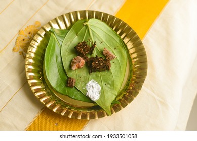 Betel leaf with areca nut paan masala, Kerala Onam festival giving Dakshina, Indian culture monastery, temple, spiritual guide or after a ritual Pooja. Indian tradition	
