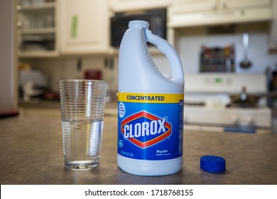 Bethesda, Maryland / USA - April 29, 2020: A person pours concentrated Clorox bleach into a glass. As with other bleach products, Clorox is a highly dangerous substance when ingested.