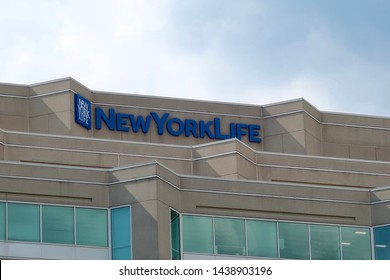 BETHESDA, MD - JUNE 29, 2019: NEW YORK LIFE - Sign And Logo On Office Building Location