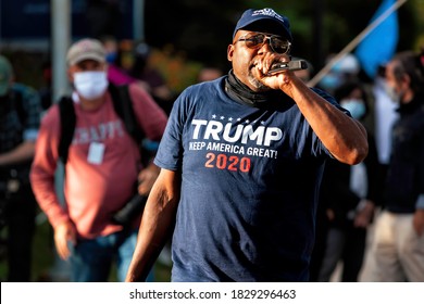 Bethesda, MD, USA - October 5, 2020: A Black Trump Supporter Enamored By The Sound Of His Own Voice Outside Walter Reed National Military Medical Center, Where Trump Was Hospitalized For Covid-19