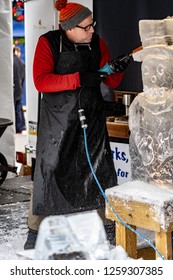 Bethlehem, PA, USA - December 9, 2018:  An Ice Carver Works At The Christkindlmarket. The Christmas Market Is Held At Steel Stacks, A Campus That Hosts Festivals, Concerts & Events.