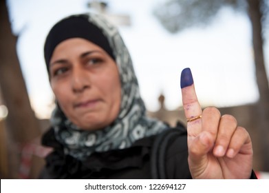 BETHLEHEM, PALESTINIAN TERRITORY - OCTOBER 20: A woman shows her ink-stained finger, indicating that she has voted in Palestinian municipal elections, Bethlehem, West Bank, Oct. 20, 2012.