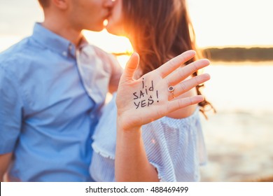 Betrothal. Proposal in the beach with a man asking marry to his happy girlfriend. Proposal concept - Powered by Shutterstock