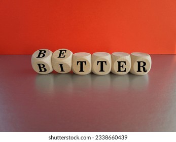 Better or bitter symbol. Concept word Better and Bitter on wooden cubes. Beautiful grey table red background. Business and better or bitter concept. Copy space. - Shutterstock ID 2338660439