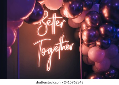 Better Together - neon sign with balloons at a wedding party. Love concept - Powered by Shutterstock