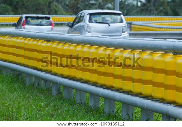 Between the best\
system of road dividers located at the corner of the highway\
installed for road safety\
users