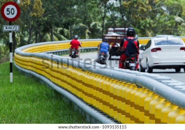 Between the best\
system of road dividers located at the corner of the highway\
installed for road safety\
users