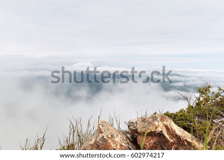between clouds on the edge of earth