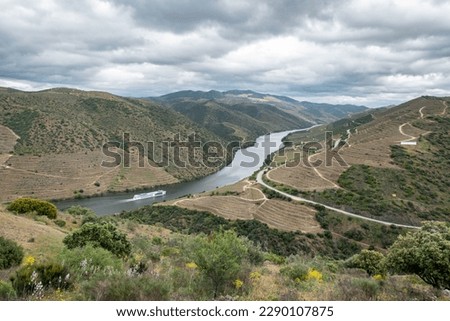 Between hills and mountains the Douro river and the small Côa river on a cloudy day in the Côa valley in Portugal