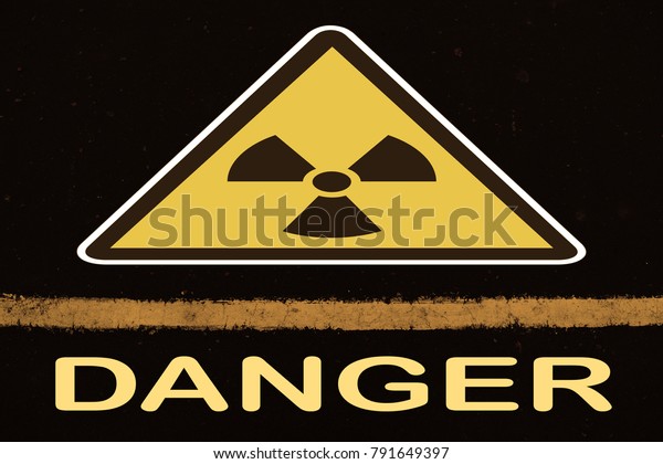 Between the\
sign and the word danger in white\
line\
