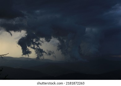 in the between of the storm and mountains