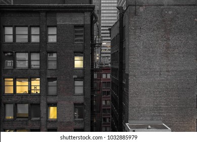 Between two buildings in an urban environment with bricks