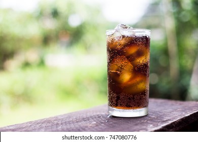 Beverage From Cola In Glass With Ice On The Wood,beverage In Summer Is Sparkling Water