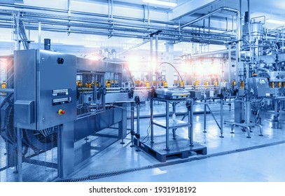 Beverage factory, Conveyor belt with bottles, food and drink production line process - Shutterstock ID 1931918192