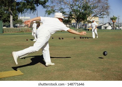 BEVERLY HILLS, CA - CIRCA 1980's: Man delivering ball in lawn bowling in Beverly Hills, CA