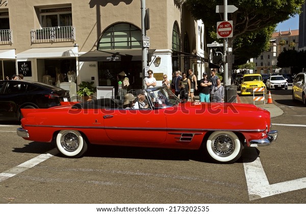 Beverly\
Hills - June 19, 2022: \
Classic 2 door red convertible at Concours\
d\' Elegance Fathers Day Car Show on Rodeo\
Drive