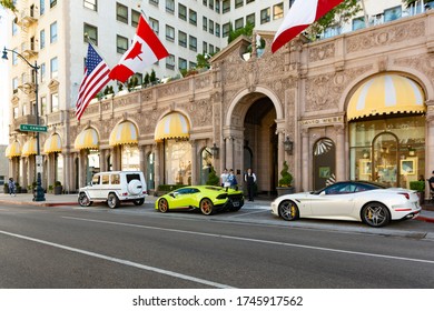 Beverly Hills, year 2017: luxury supercars parked outside the Four Seasons hotel on Wilshire Boulevard. Rich lifestyle.