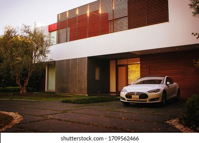 Beverly Hills, Year 2017: Modern Mansion With Electric Luxury Car Tesla. Millionaire Lifestyle.