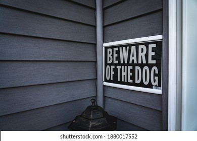 Beware Of The Dog Sign Against House Siding